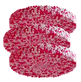 Three disks made out of pink and white round particles stacked on top of each other